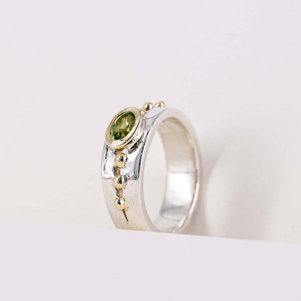 Oval Peridot 9ct Yellow Gold Mount on Silver Band Ring