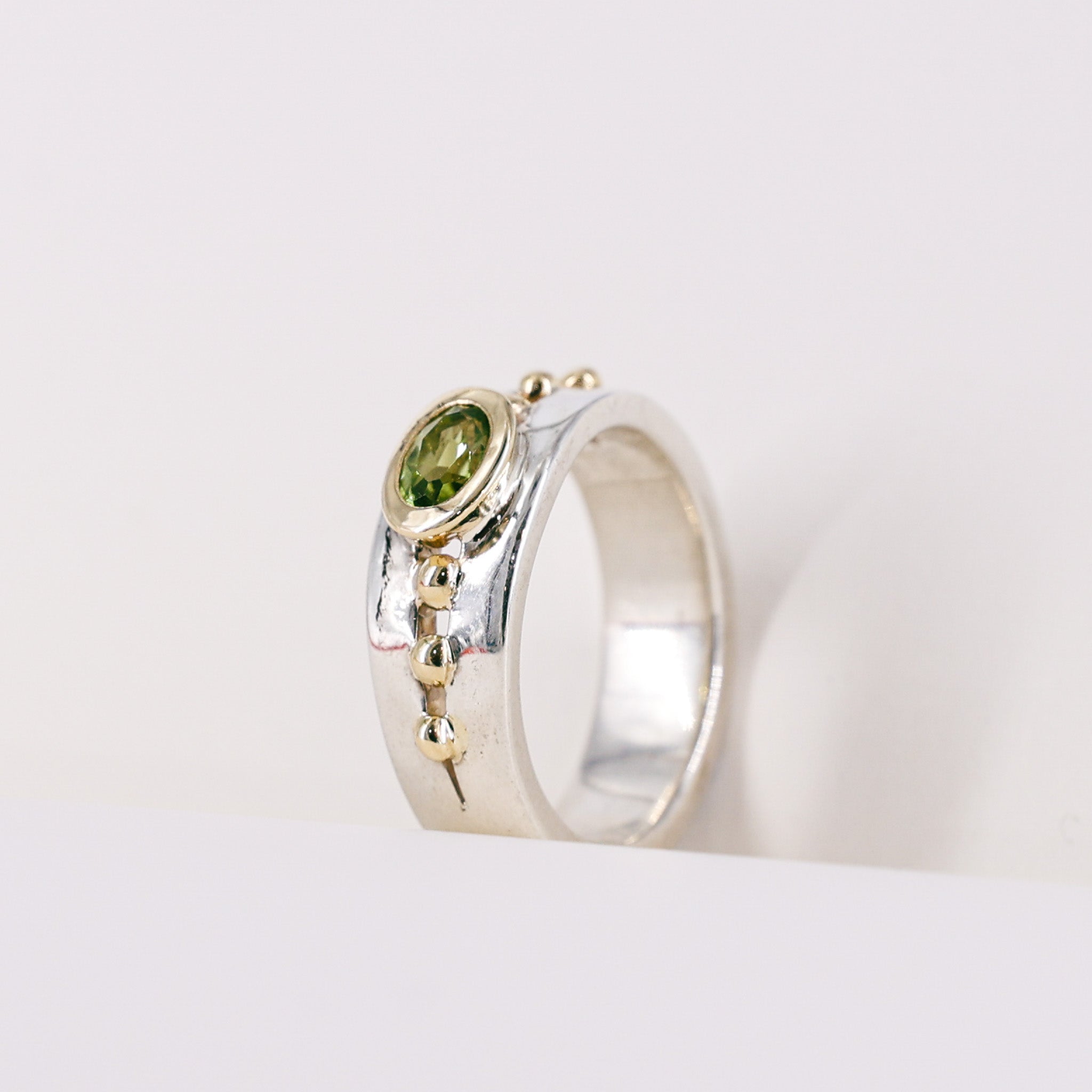 Oval Peridot 9ct Yellow Gold Mount on Silver Band Ring