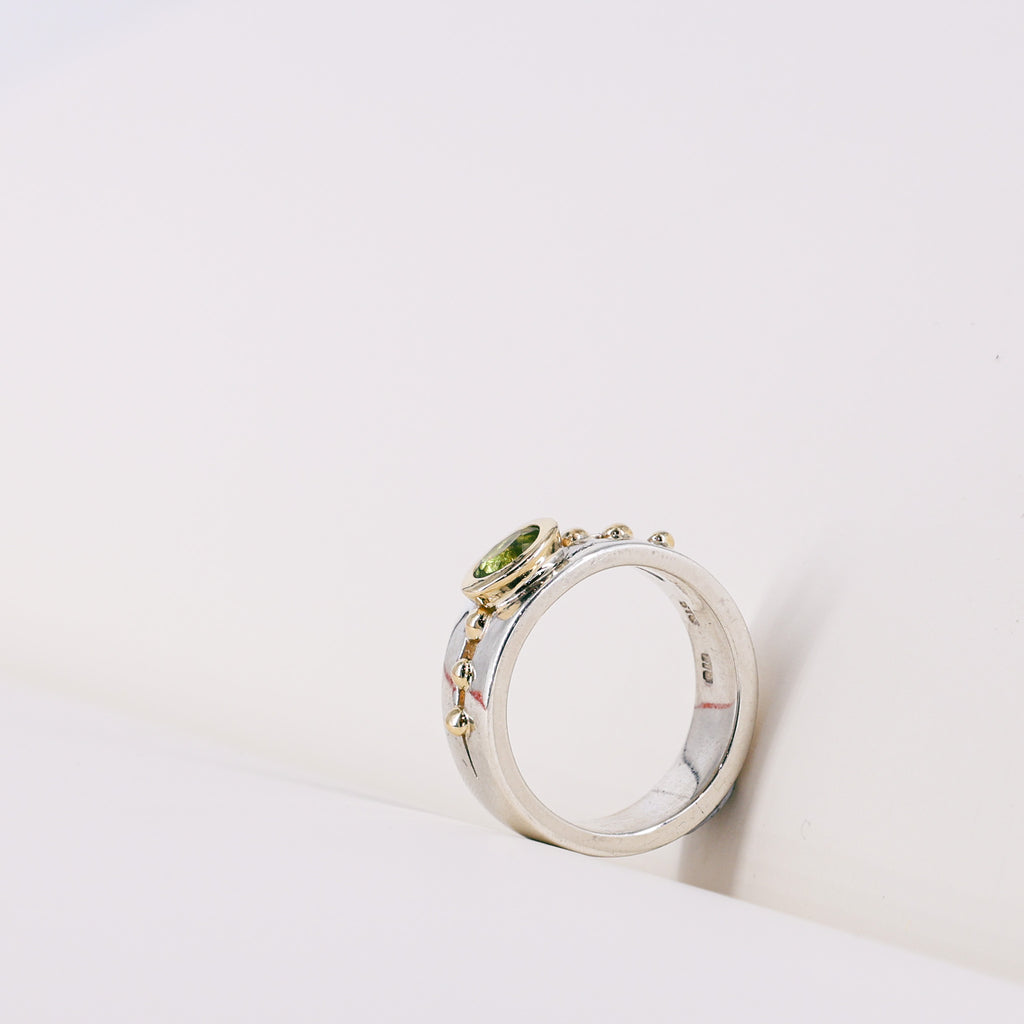 Oval Peridot 9ct Yellow Gold Mount on Silver Band Ring