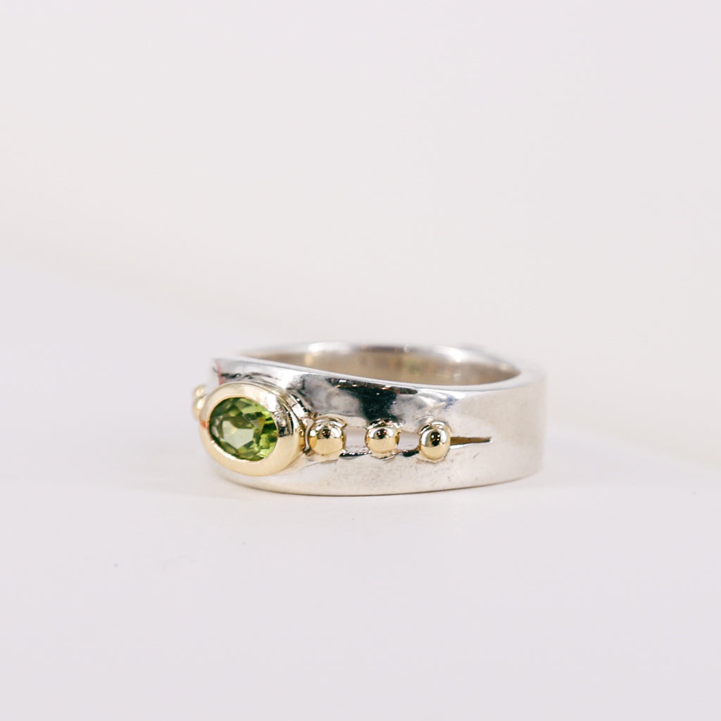 Oval Peridot 9ct Yellow Gold Mount on Silver Band Ring