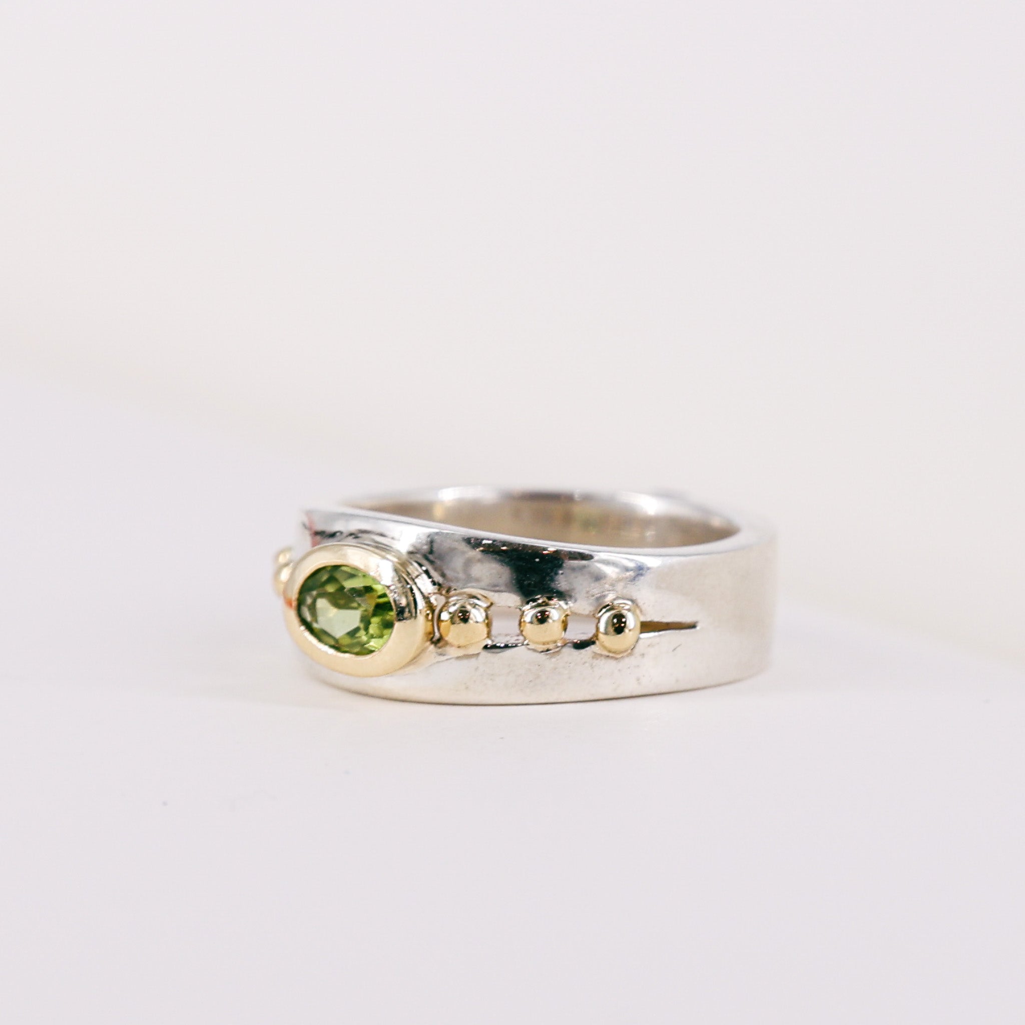 Oval Peridot 9ct Yellow Gold Mount on Silver Band Ring