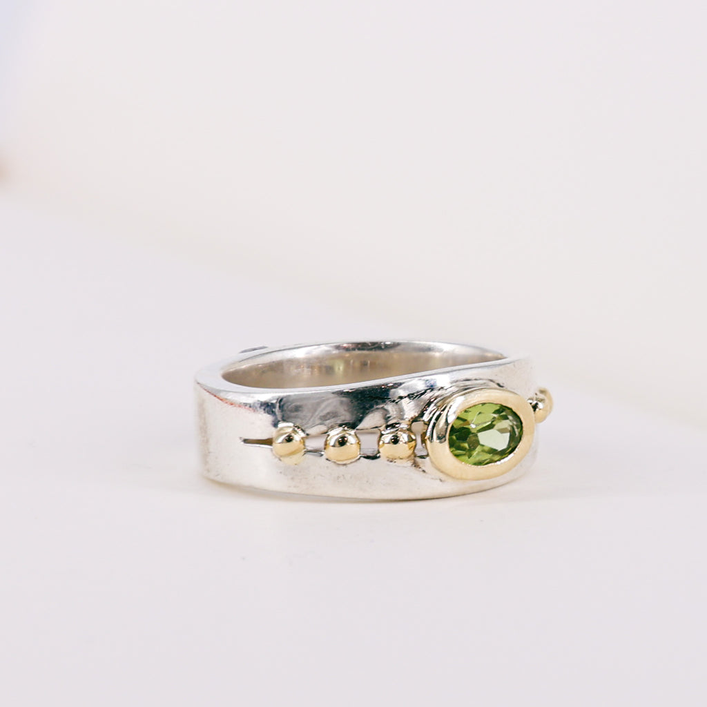 Oval Peridot 9ct Yellow Gold Mount on Silver Band Ring